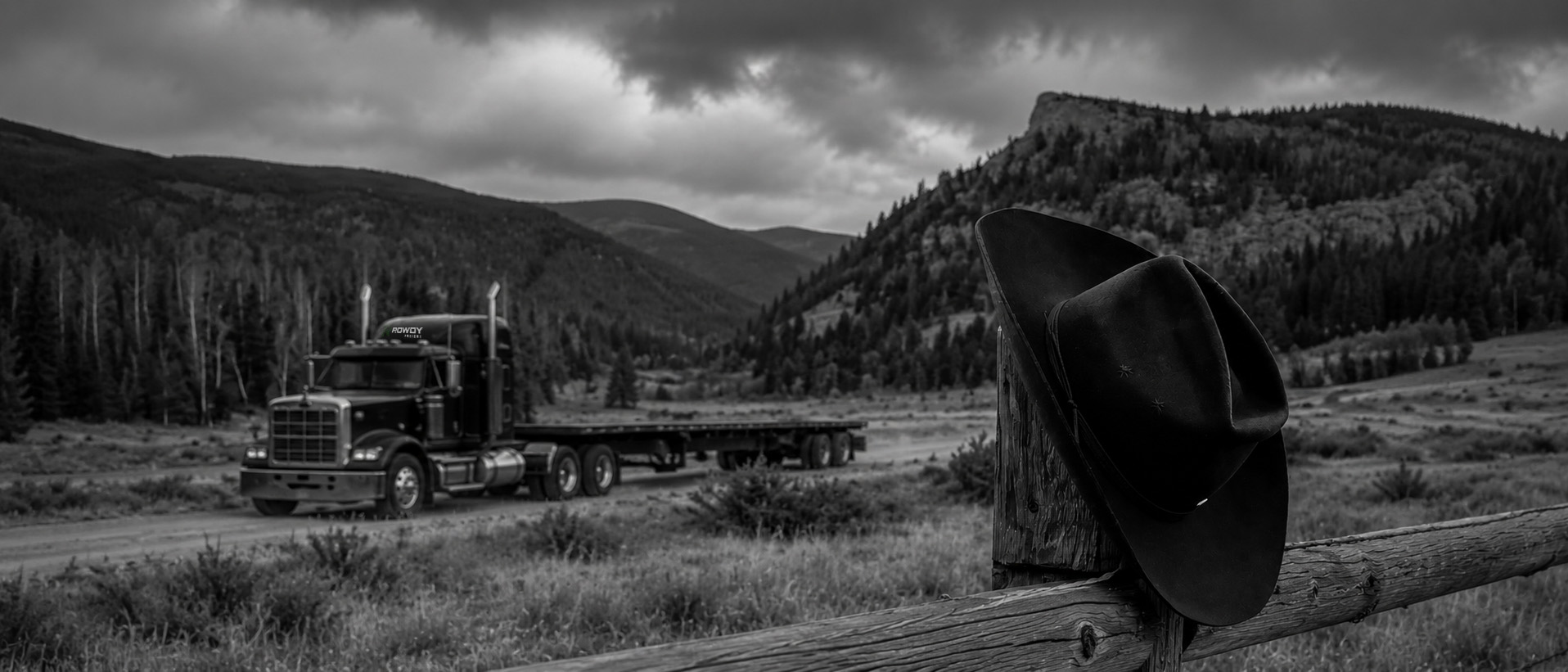 ROWDY Freight flatbed tractor on a TX & OK lane